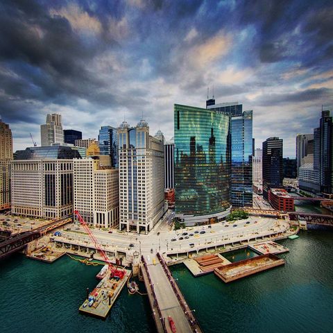 cityscape from above over water during a storm rolling in overhead