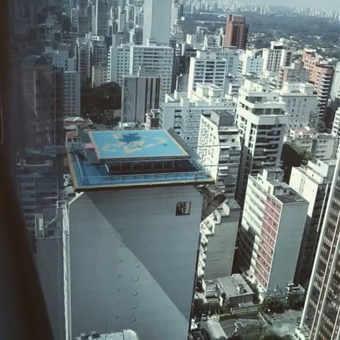 overhead view of city buildings from inside a helicopter