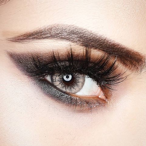 close up of a hazel eye with a dark eye shadow applied