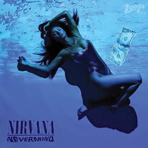 Woman with dark hair laying underwater in a shiny purple body suitr with one leg bend over the other and her hands relaxed upwards with a dollar bill in front of her attached to a hook and the text Nirvana, Nevermind, and Loop 97.9 are placed in the corners